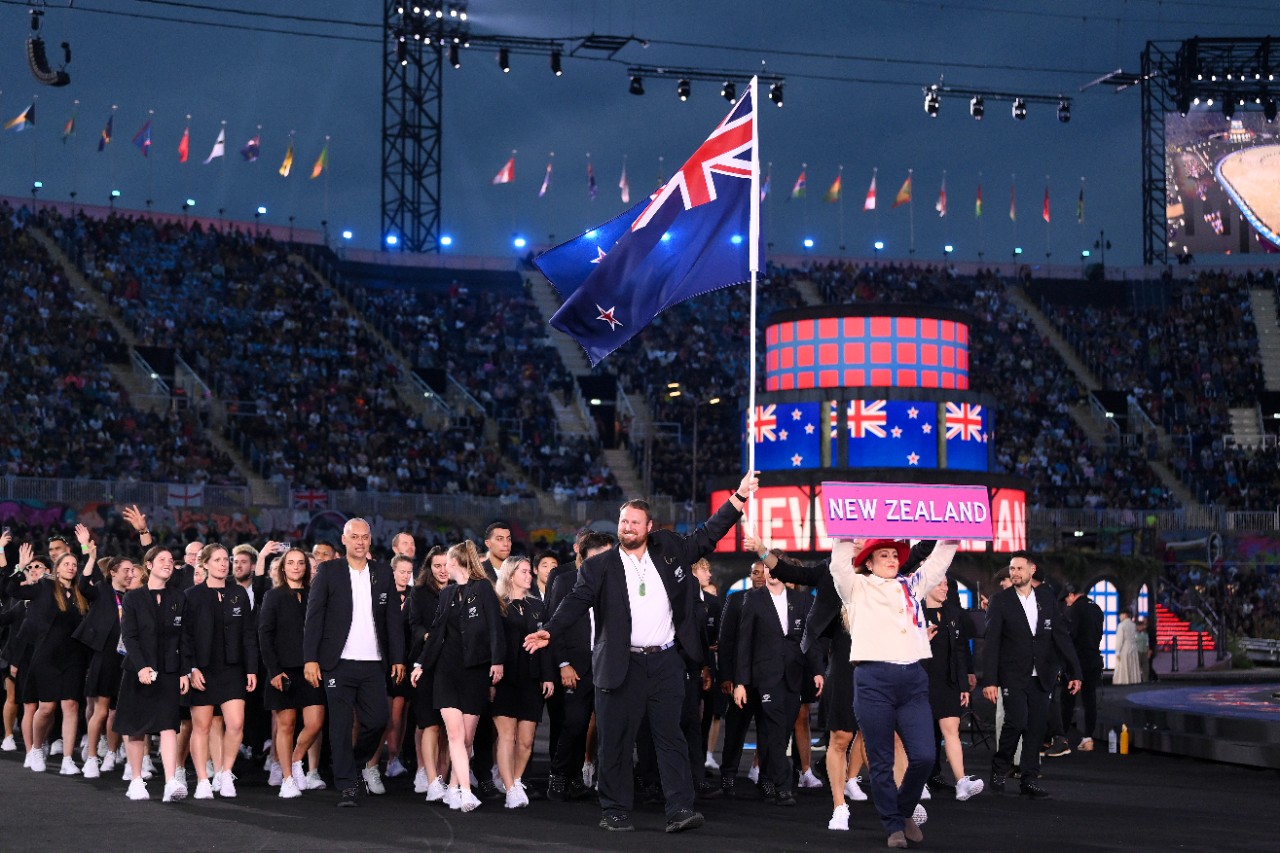 BIRMINGHAM, ENGLAND - JULY 28: Tom Walsh and Joelle King, Flag Bearers of Team New Zealand lead their team out during the Opening Ceremony of the Birmingham 2022 Commonwealth Games at Alexander Stadium on July 28, 2022 on the Birmingham, England. (Photo by David Ramos/Getty Images)