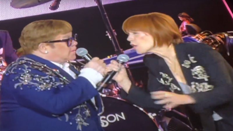 Kiki Dee and Elton John reunite onstage to perform their hit song, after 16 years