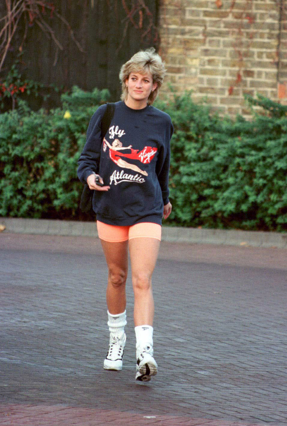 LONDON - NOVEMBER 1995:  Princess Diana, Princess of Wales, wearing  Virgin Atlantic sweatshirt, leaves Chelsea Harbour Club, London in November, 1995.  (Photo by Anwar Hussein/WireImage) 