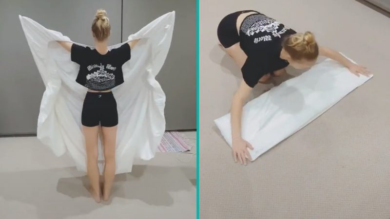 Woman showcases how she folds a fitted sheet completely flat in just a few seconds